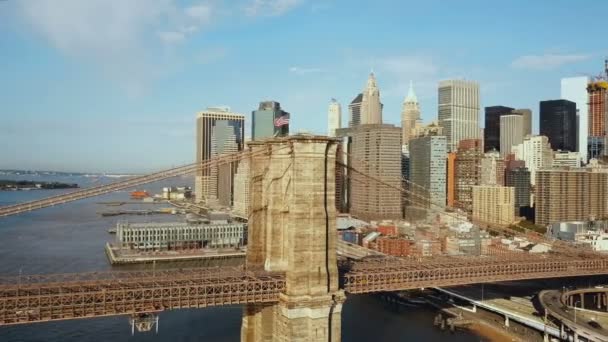 Aerial view of the Brooklyn bridge through East river to Manhattan in new York, America. Drone flying over the water. — Stock Video
