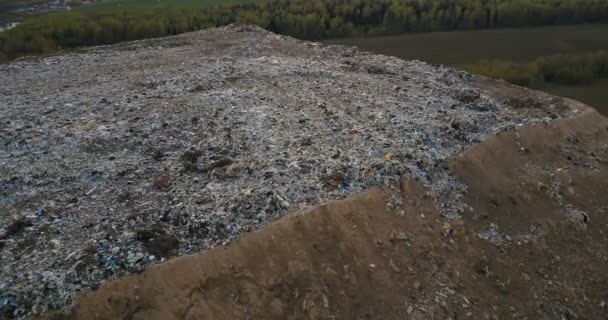 Copter flying around the urban dump with waste trash of life and production. Aerial view of big pile of trash. — Stock Video