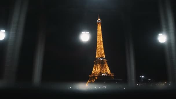 PARIS, 24 03 2019 Beautiful view of amazing Eiffel Tower with night lights from a driving car window slow motion. — Stock Video