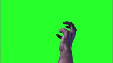 zombi, Cadılar Bayramı'nda yeşil bir arka plan üzerinde el