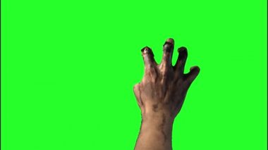 zombi, Cadılar Bayramı'nda yeşil bir arka plan üzerinde el