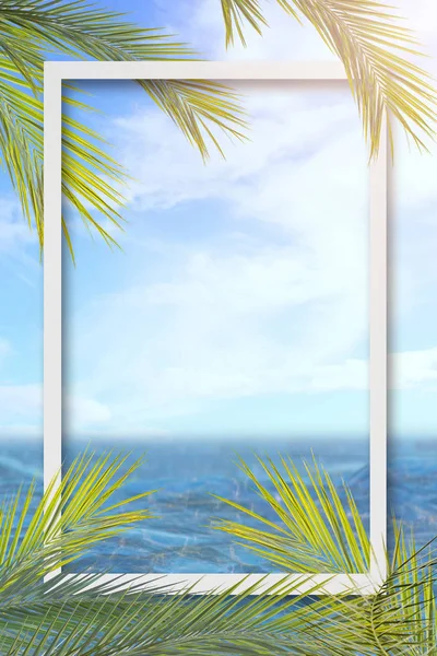 Summer background with frame, nature of tropical golden beach with rays of sun light and leaf palm. Golden sand beach close-up, sea water, blue sky. Copy space, summer vacation concept