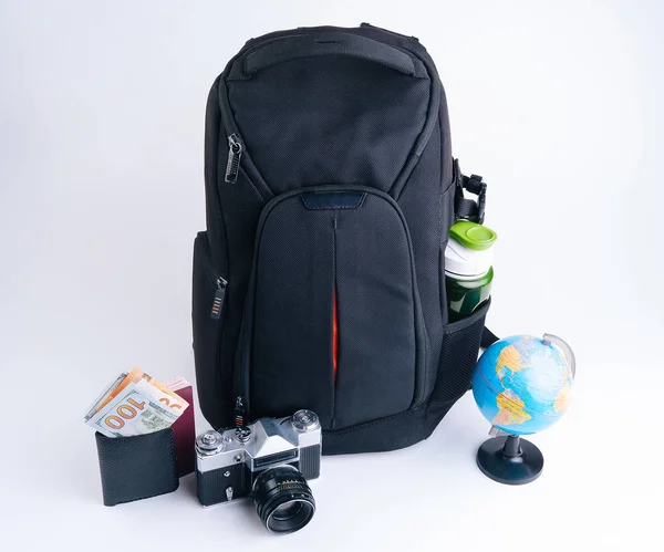 Black backpack with wallet passport old vintage camera for trave — Stock Photo, Image