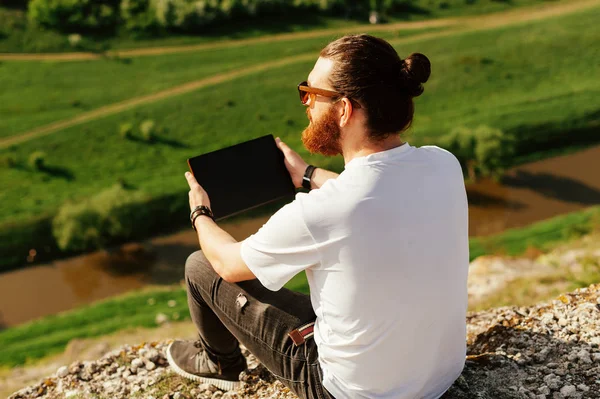 Portrait Young Handsome Bearded Hipster Man Using Tablet Looking Downward — Stock Photo, Image