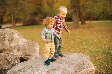 Happy little brothers enjoying time together and having fun