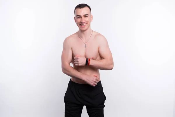 Photo of fitness young man posing over white background — 스톡 사진
