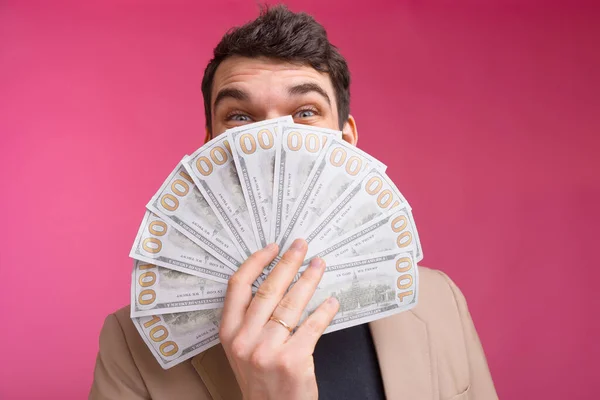 Close up photo of man holding money over his face — Stock Photo, Image