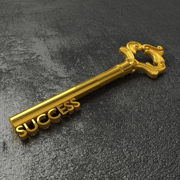 The golden key to success on a black stone table — Stock Photo, Image