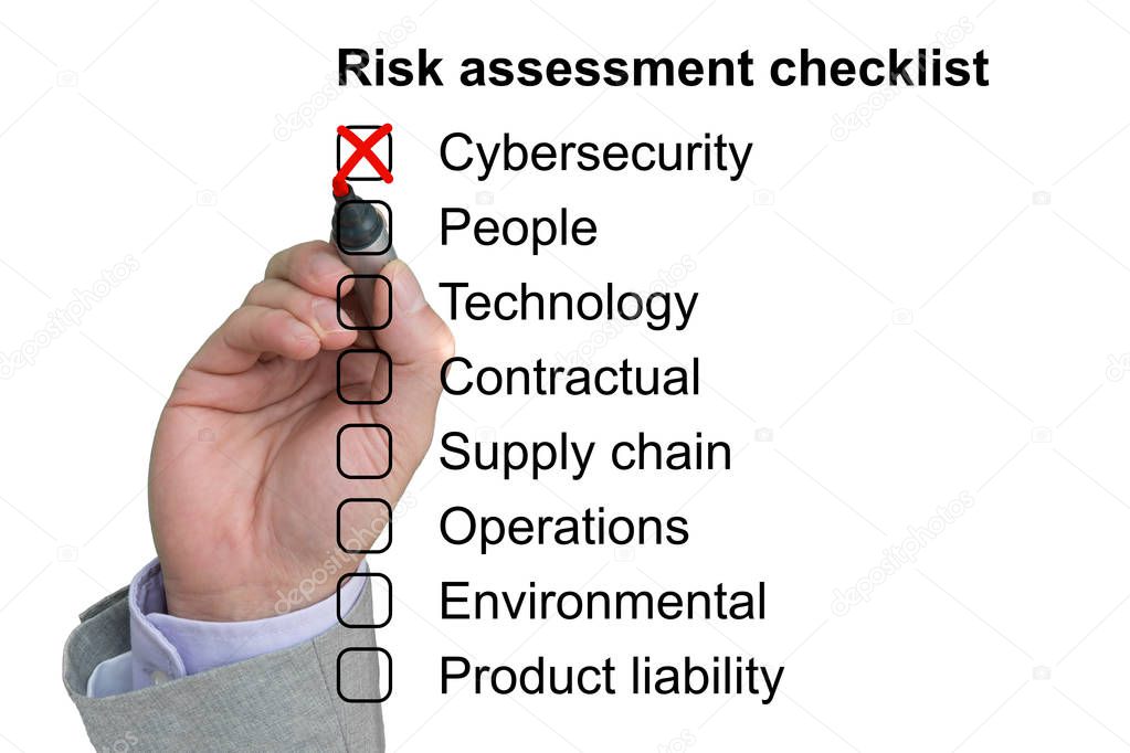 Hand crosses off first item of a risk assessment checklist