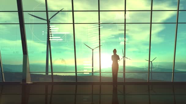 Business woman in her office on the background of wind power plants and infographics. — Wideo stockowe