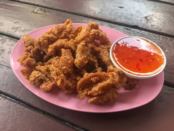 Deep fried skin chicken on plate with sauce — Stock Photo, Image