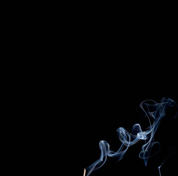 Abstrato fumaça de joss stickon fundo preto — Fotografia de Stock