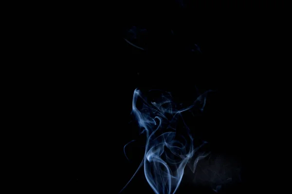 Humo abstracto de joss stickon fondo negro — Foto de Stock