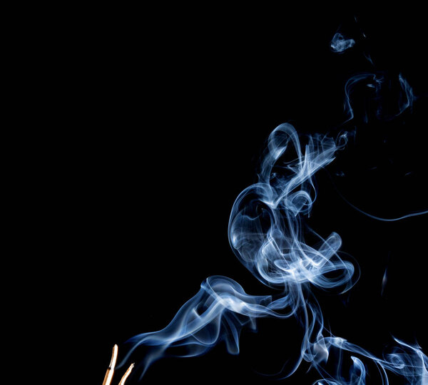 Abstract smoke of joss stickon black background