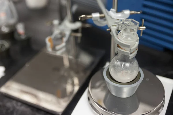 Round-bottom flask and Burette clamp in laboratory — 스톡 사진