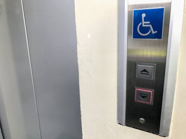 Elevator with sign for disable wheelchair people