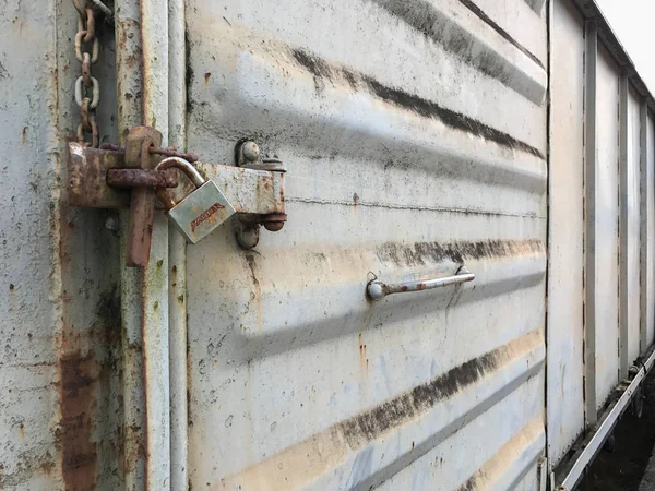 Old key lock on rusty freight container locked — Stock Photo, Image