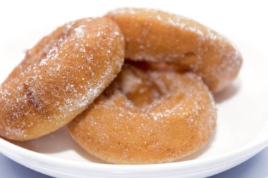Donut on white plate isolated on white