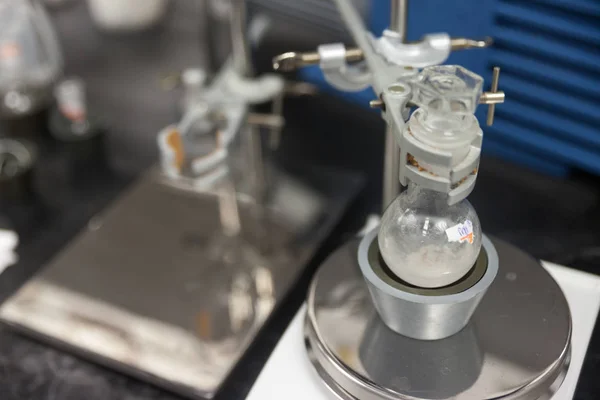 Round bottom flask and Burette clamp in laboratory — 스톡 사진