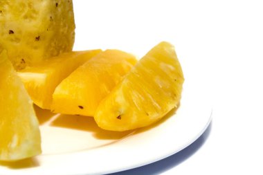 pineapple on white plate isolated on white