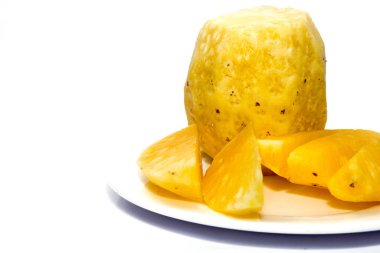 pineapple on white plate isolated on white