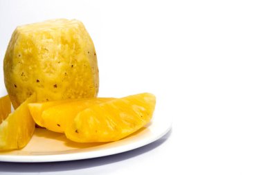 pineapple on white plate isolated on white