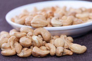 close up of Stack of Cashews on bowl 