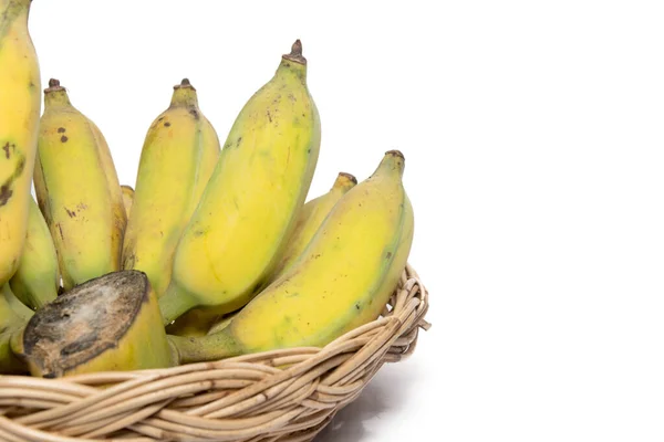 Yellow banana in basket isolated on white — Stok fotoğraf