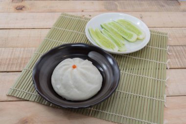 Chinese dim sum BBQ Pork Bun, Pandan pau or bao and cucumber in 