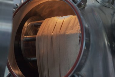 close up of textile factory steam machine at factory