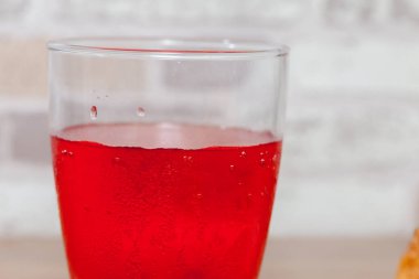 close up of red apple pomegranate juice