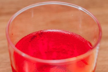 close up of red apple pomegranate juice