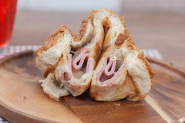 close up of ham and cheese bun