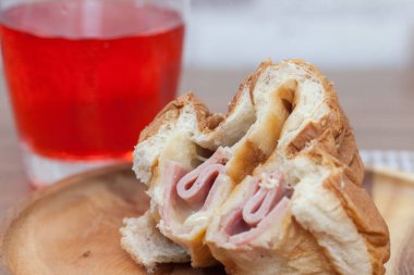 close up of ham and cheese bun