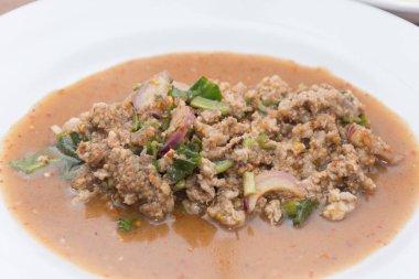 close up of Spicy minced pork salad on plate