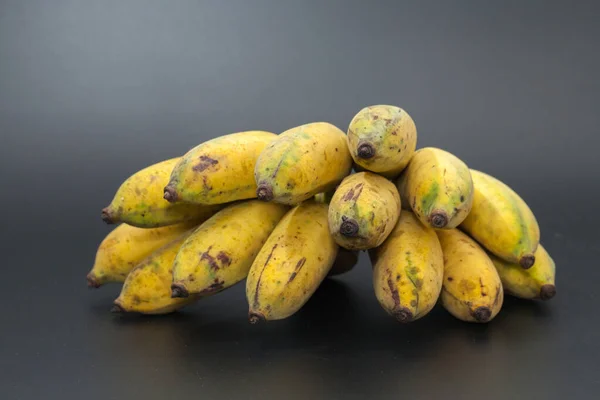 A bunch of bananas on black background — Stock Photo, Image