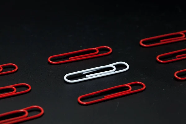 Row of paper clip on black background, different concept — Stock Photo, Image