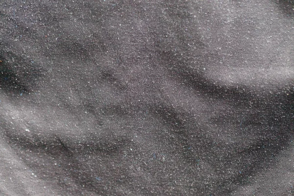 Close up of dust on black shirt — стоковое фото