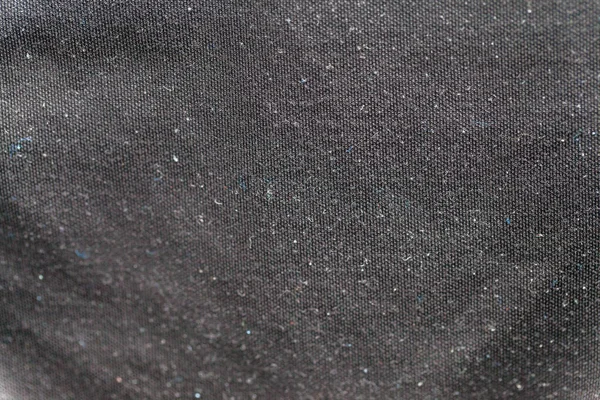 Close up of dust on black shirt — Stock Photo, Image