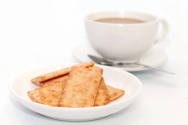 Cocco cracker biscotto e caffè su sfondo bianco — Foto Stock