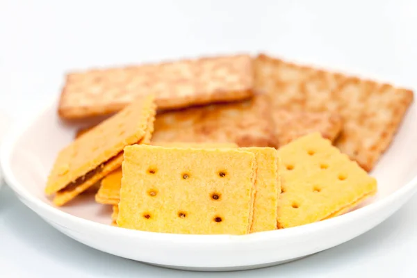 Pineapple biscuit and coconut cracker biscuit on white plate — Stock Photo, Image