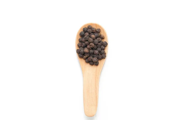 Pile of pepper on wooden spoon isolated on white background — Stock Photo, Image