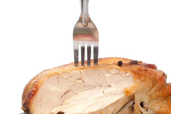 Tenendo pollo arrosto con forchetta su sfondo bianco — Foto Stock