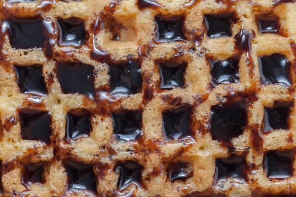Textura abstrata de waffle com chocolate derretido — Fotografia de Stock