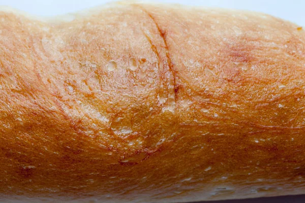 Abstrakte Textur des französischen Brotes isoliert auf weißem Hintergrund — Stockfoto