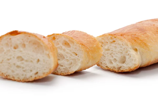 Uma fatia de pão francês isolado no fundo branco — Fotografia de Stock