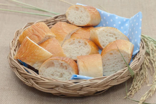 A slice of french bread on basket — ストック写真