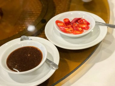 sauce and chilli serve on the table