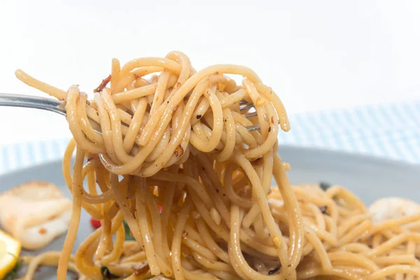 Close up of spaghetti seafood with fork — 스톡 사진