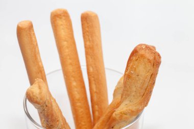bread stick on cup isolated on white background
